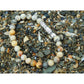 Handmade, natural Crazy agate bracelet, beautiful brownish nuance 6 mm bead stretch bracelet, with a long metal Tibetan style bead, sitting on a rock on the Irish shore in West Cork