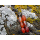 Handmade, natural red and orange agate drop earrings with 3 beads, beautiful nuances of red, orange, brown and grey,  12x8 mm size bead.  Length is 4.5 cm. Metal parts are stainless steel. Irish shore rocks background. West Cork