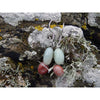 Handmade, natural Amazonite gemstone earrings, made with 2 different coloured 9.6mm tumble stones sitting on the Irish rocky shore of West cork