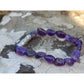 Handmade, natural Amethyst gemstone bracelet, beautiful purple 6x8 mm nuggets with a long metal bead as well, sitting on a rock on the Irish shore in West Cork